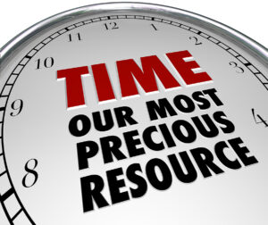 Image of a large clock face with the bold text 'TIME - Our Most Precious Resource,' emphasizing the value of time management and productivity.